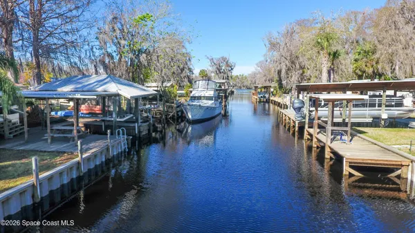a view of a swimming pool with outdoor seating