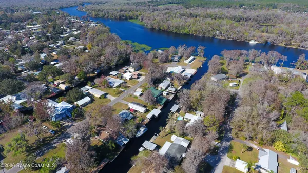 a room with lots of furniture and a chandelier