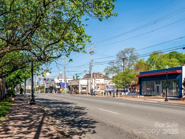 a view of street with stores