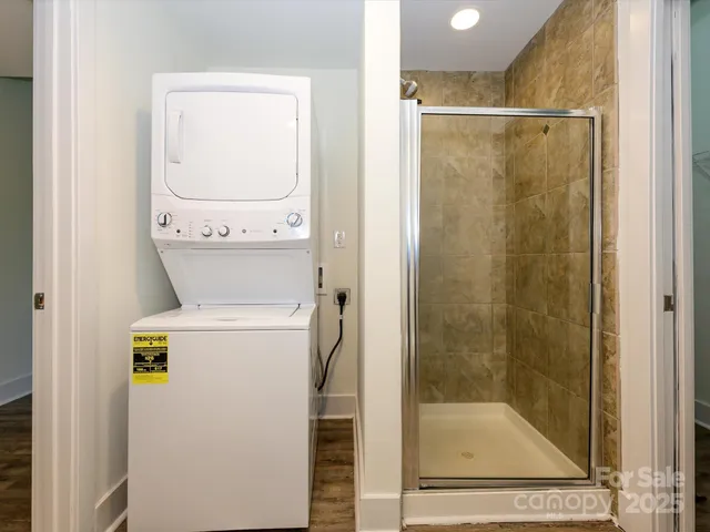 a bathroom with a shower and toilet
