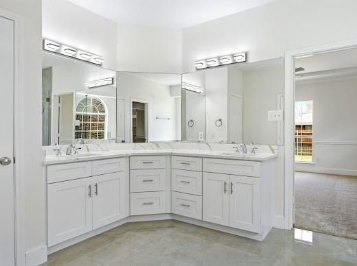5034 West Fall Drive Midlothian, TX 76065 - Photo 22 of 40 Spacious bathroom featuring a dual vanity with white cabinetry and light-toned countertops