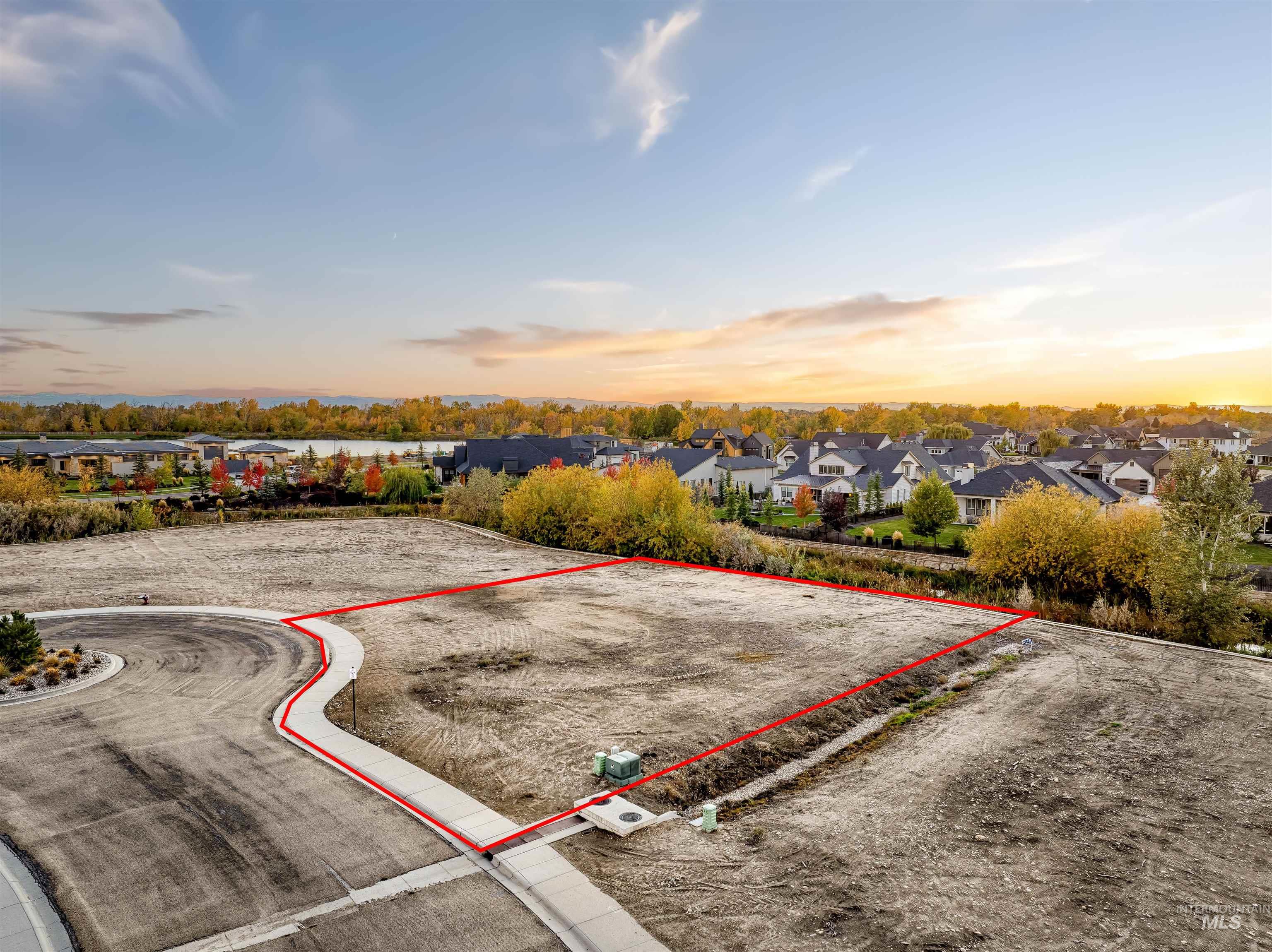 Aerial view at dusk of property parcel outlined