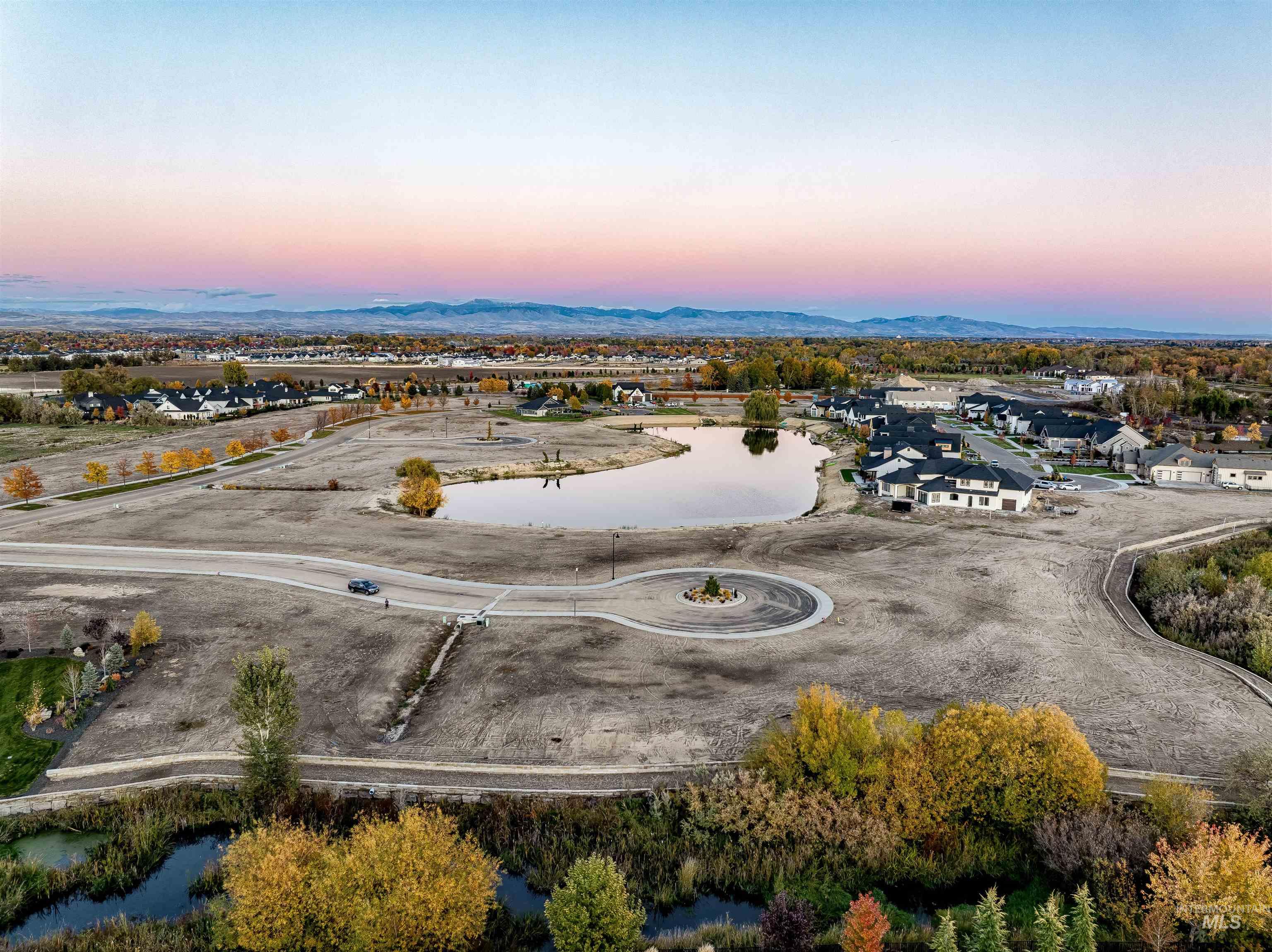 21531 Rabbit Creek Place Star, ID 83669 - Photo 11 of 17 Aerial view at dusk of a water and mountain view and a residential view