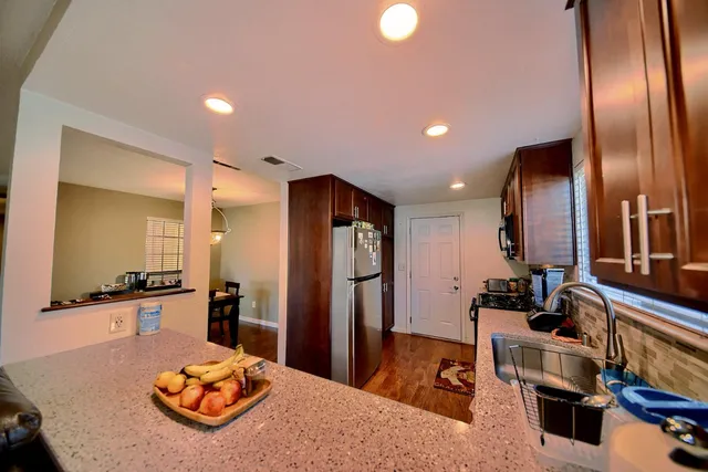 a view of hallway with wooden floor
