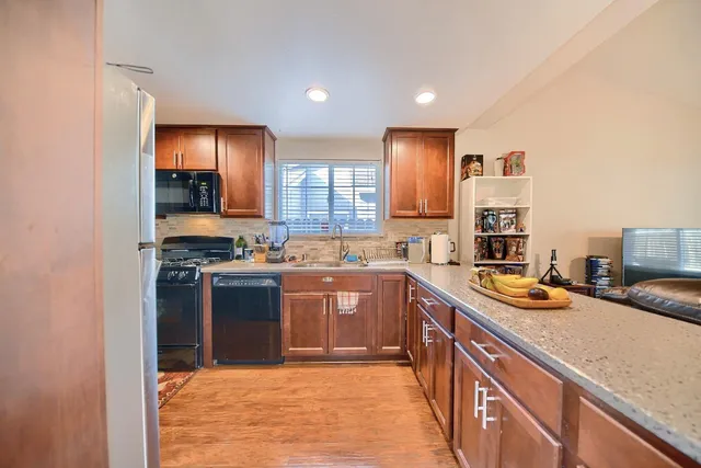 a view of a dining room with furniture and a chandelier