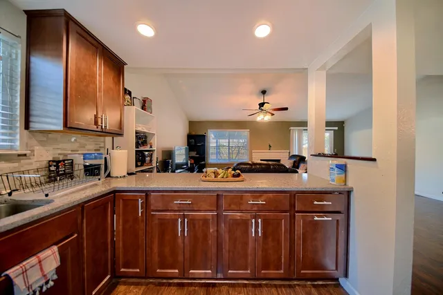 a kitchen with a sink stove and refrigerator