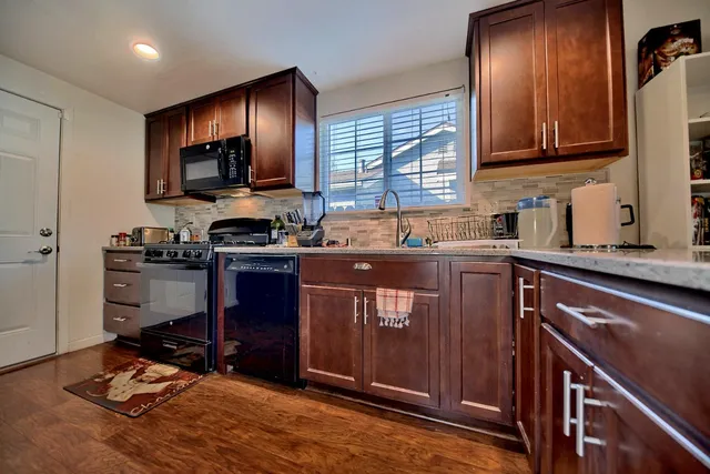 a view of a livingroom with furniture and a flat screen tv