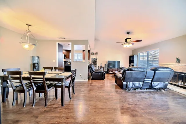 a view of a livingroom with furniture and wooden floor