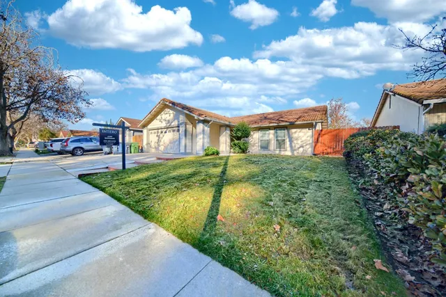 a view of building with car parked