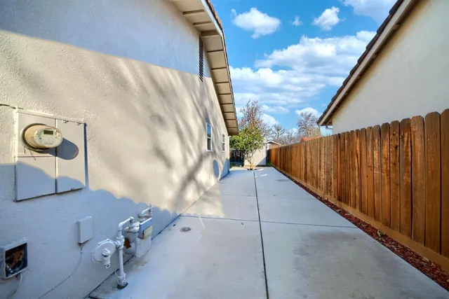a view of an outdoor sitting area with brick walls