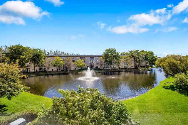 a view of a lake with a house in the background