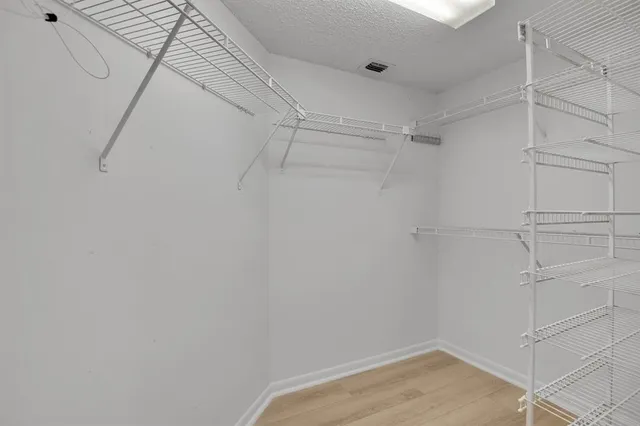 a view of a room with racks on the wall