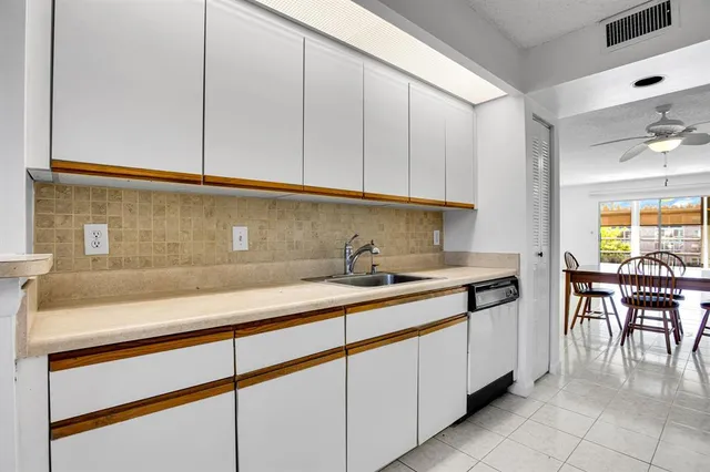 a kitchen with a sink and cabinets