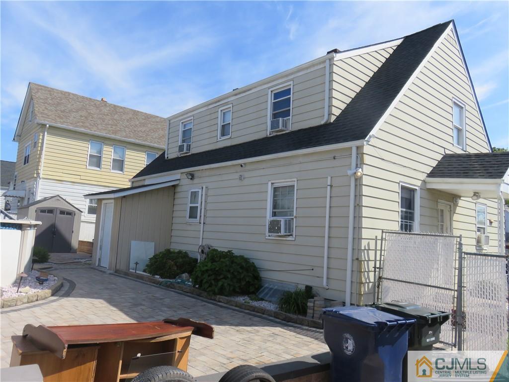 551 Colgate Avenue Perth Amboy, NJ 08861 - Photo 16 of 16 a backyard of a house with seating space