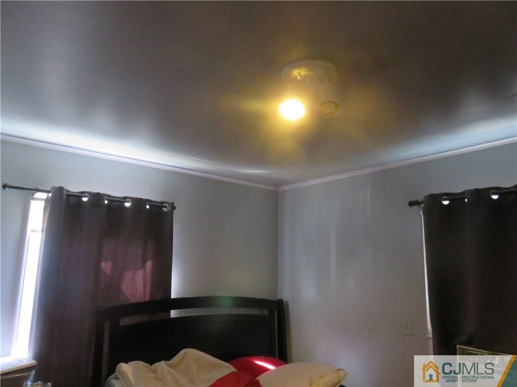 551 Colgate Avenue Perth Amboy, NJ 08861 - Photo 9 of 16 a view of an empty room