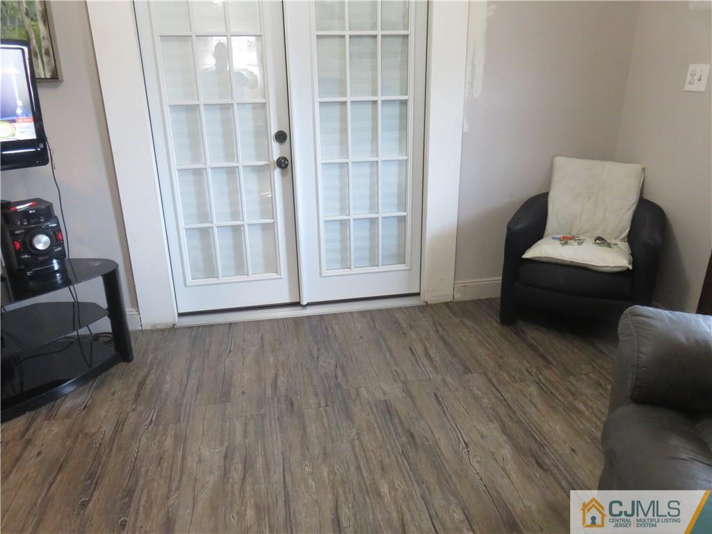 551 Colgate Avenue Perth Amboy, NJ 08861 - Photo 10 of 16 a living room with furniture and a window