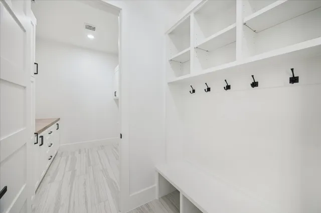 a view of a kitchen sink with wooden floor