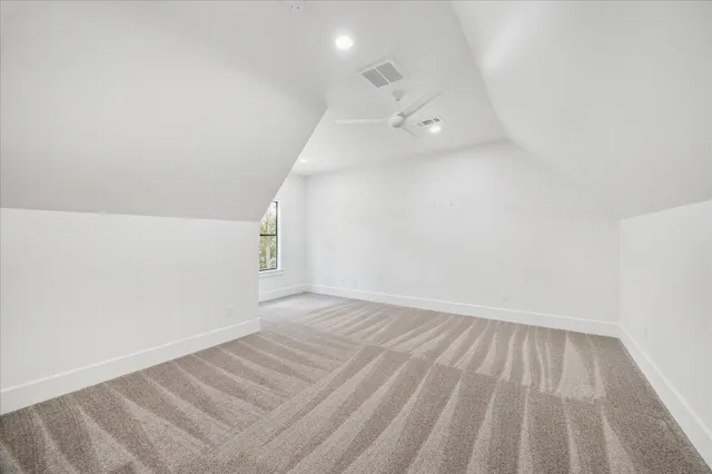 an empty room with windows and entrance