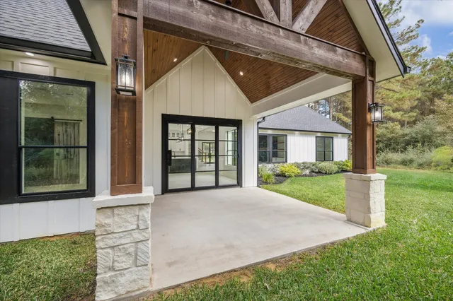 a view of a porch and garden