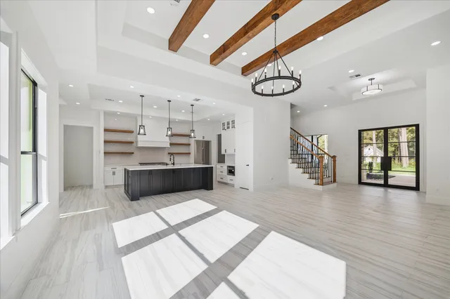 a view of kitchen with stainless steel appliances cabinets and a wooden floor
