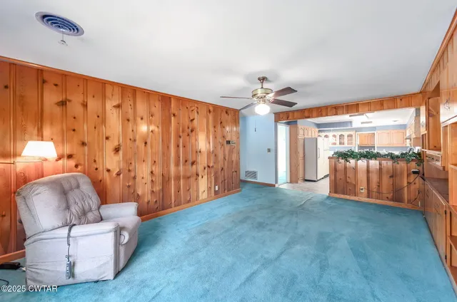a large kitchen with stainless steel appliances granite countertop a sink and cabinets