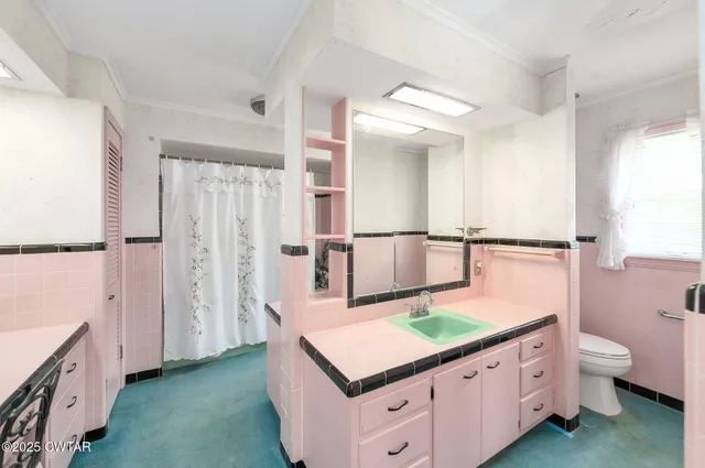 a bathroom with a sink a mirror and a shower