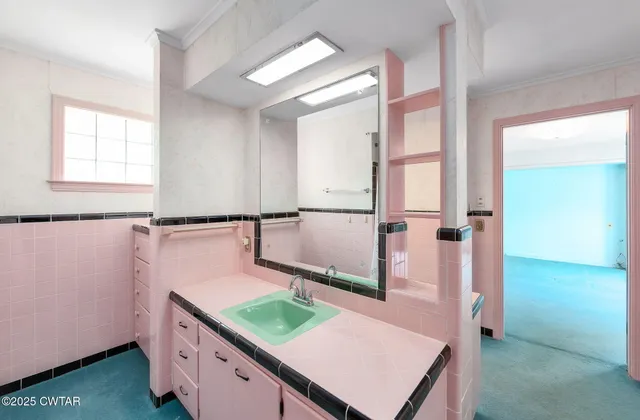 a view of a room with stairs and windows