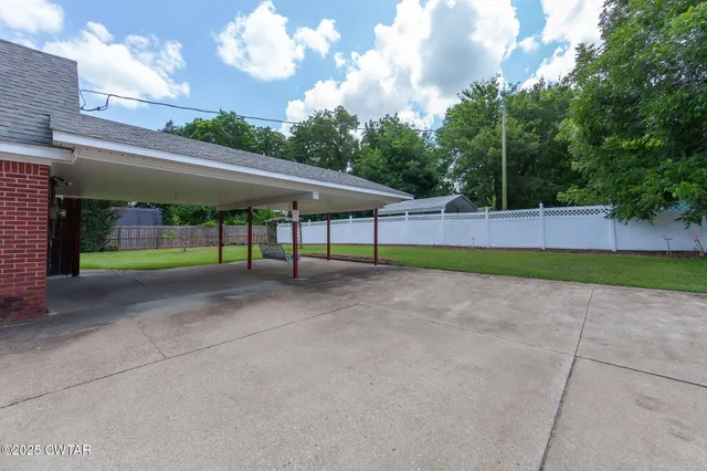 a view of backyard with green space