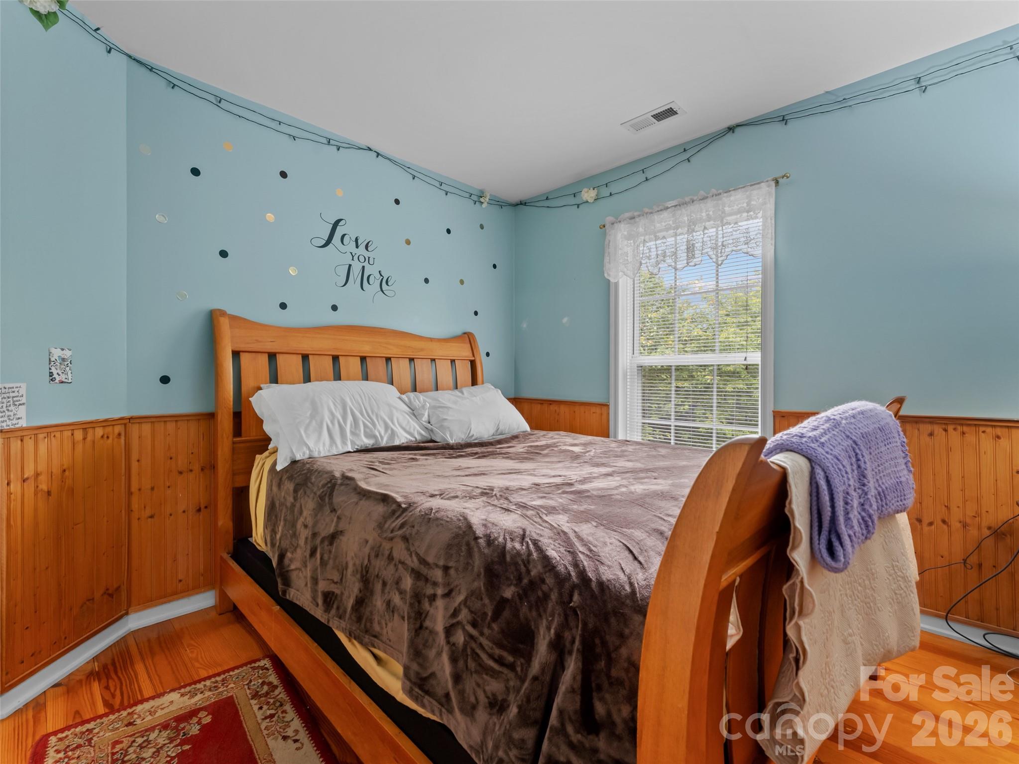 103 Old Southside Road Saluda, NC 28773 - Photo 34 of 48 a bed sitting in a bedroom next to a window