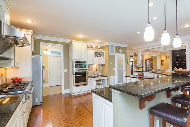 3590 Traveler Road Harrisonburg, VA 22801 - Photo 17 of 50 a kitchen with stainless steel appliances granite countertop a stove and a view of living room