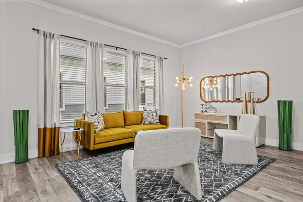 a living room with furniture and a rug