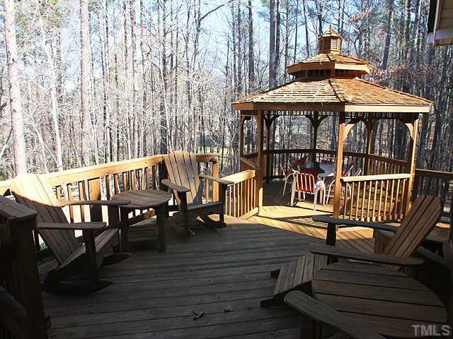 2504 Barton Ridge Court Raleigh, NC 27613 - Photo 20 of 25 Deck with a gazebo overlooks the hardwoods in the privacy of a cul-de-sac yard. Patio/Deck