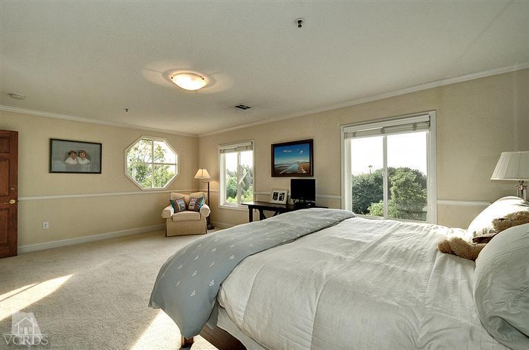 11675 Barranca Road Camarillo, CA 93012 - Photo 12 of 19 a bed room with a bed window and a large mirror
