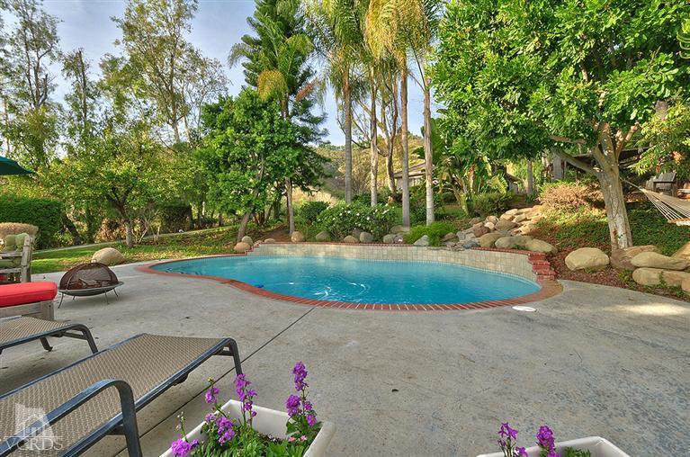 11675 Barranca Road Camarillo, CA 93012 - Photo 17 of 19 a view of a backyard with plants and a patio