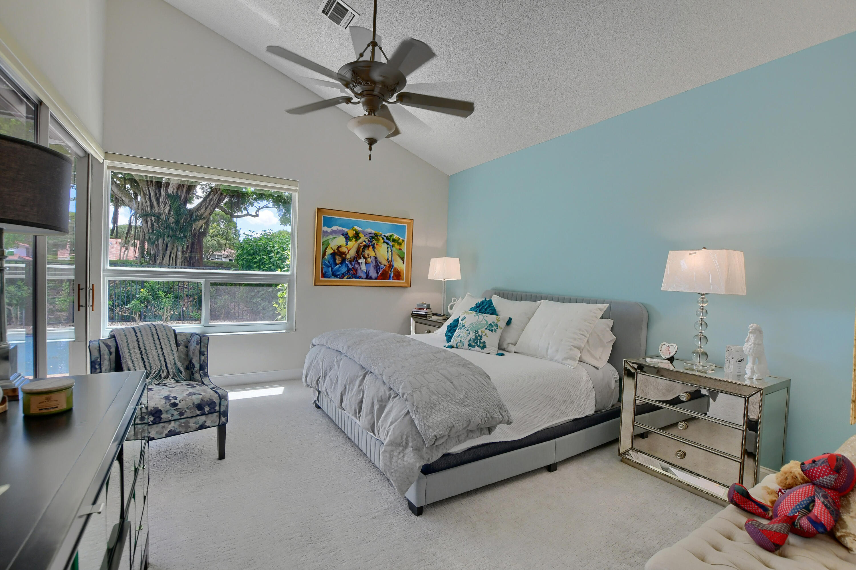 5360 Northwest 20th Avenue Boca Raton, FL 33496 - Photo 13 of 28 a bedroom with a bed a couch and a window