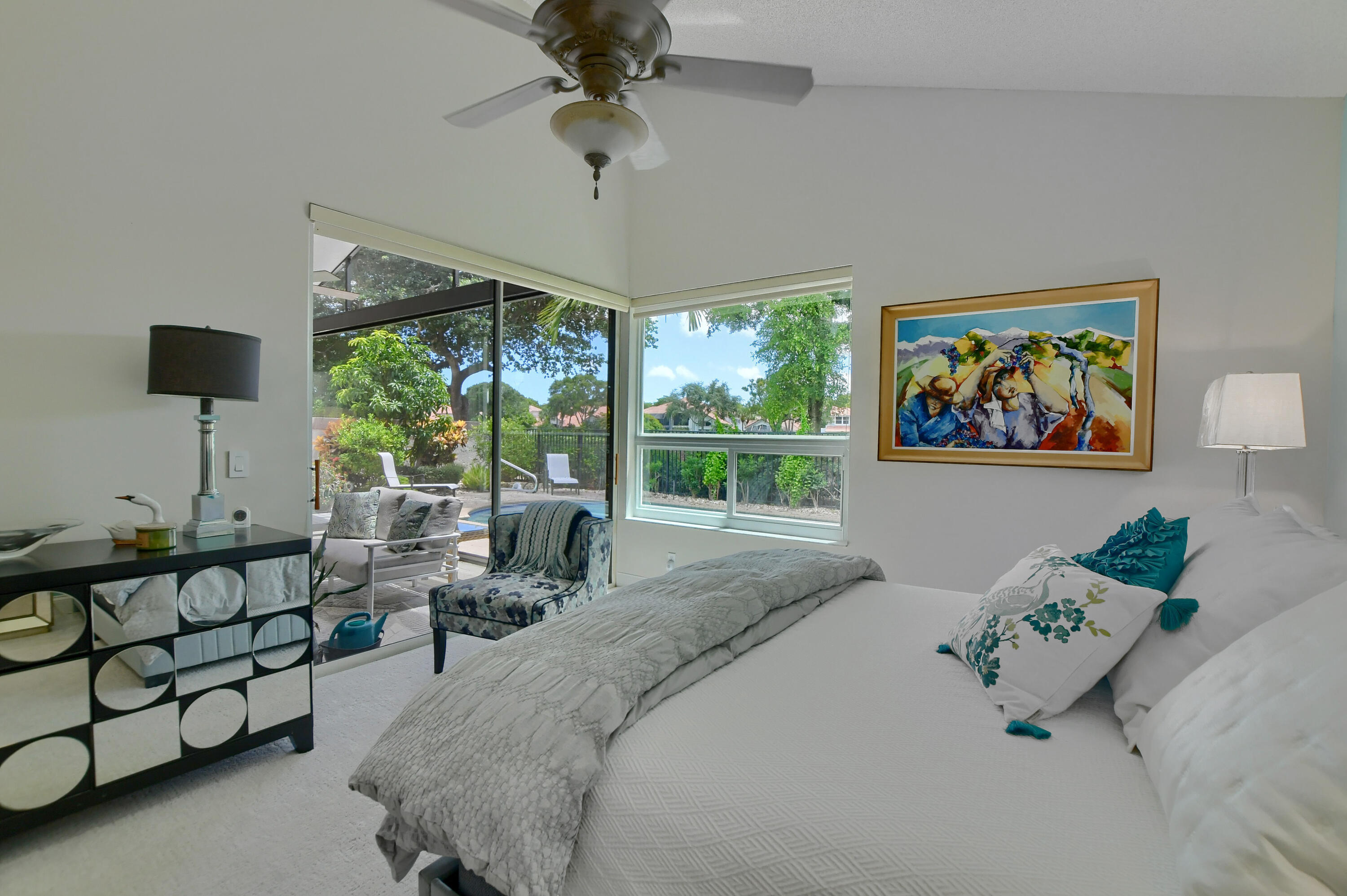 5360 Northwest 20th Avenue Boca Raton, FL 33496 - Photo 14 of 28 a bedroom with furniture and a large window