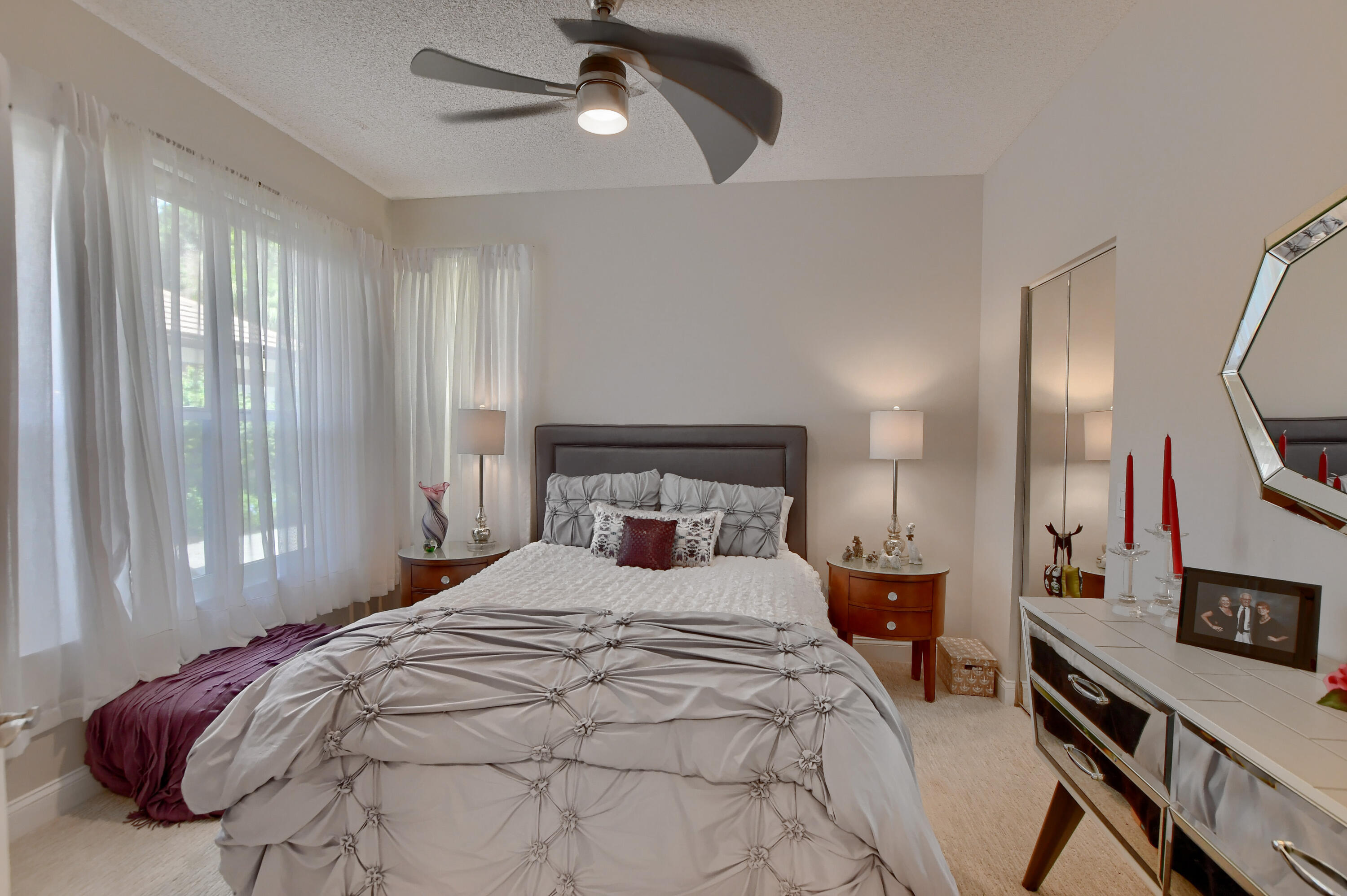 5360 Northwest 20th Avenue Boca Raton, FL 33496 - Photo 16 of 28 a bedroom with a large bed and a tv