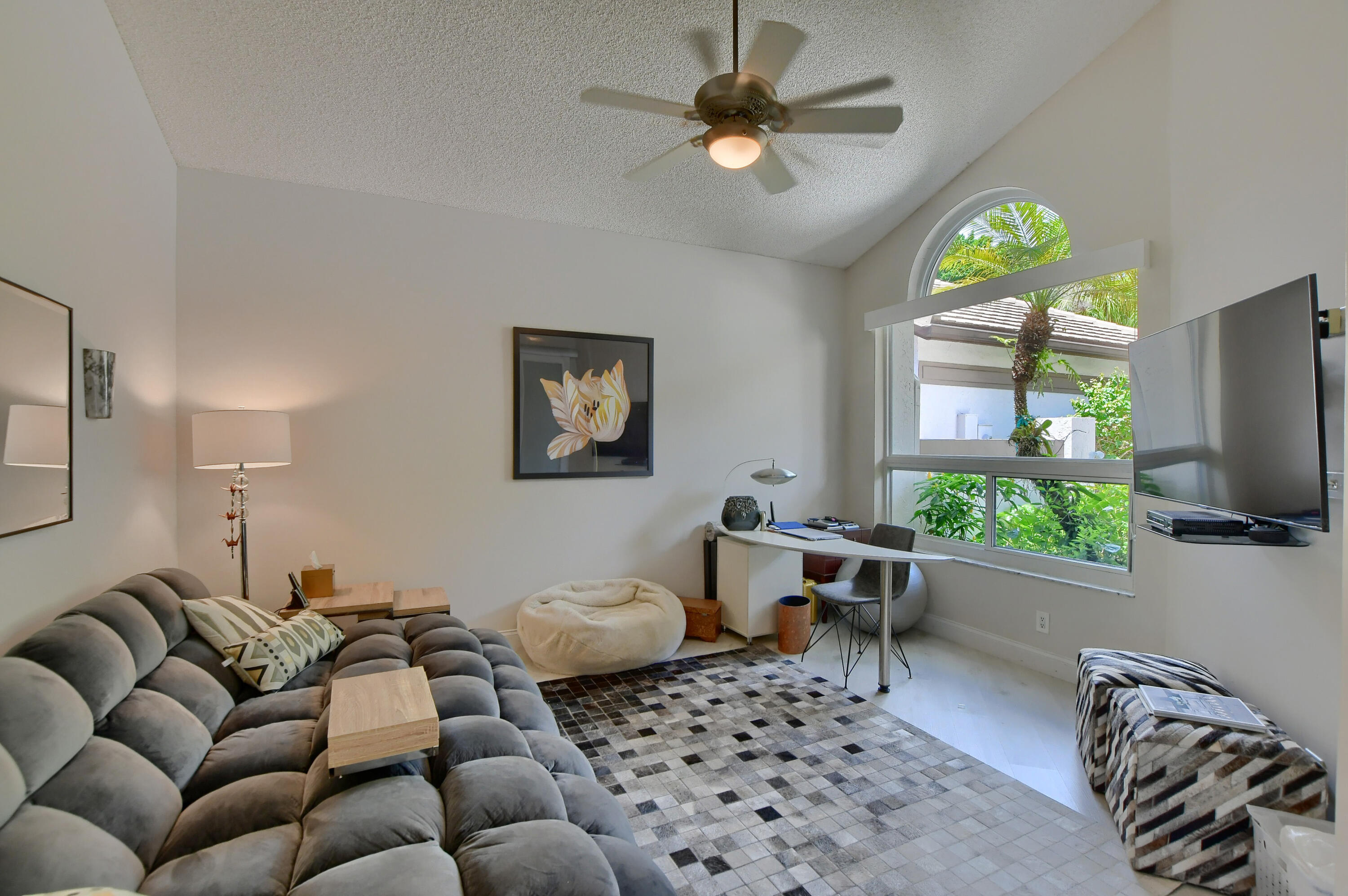 5360 Northwest 20th Avenue Boca Raton, FL 33496 - Photo 4 of 28 a living room with furniture a window and a flat screen tv