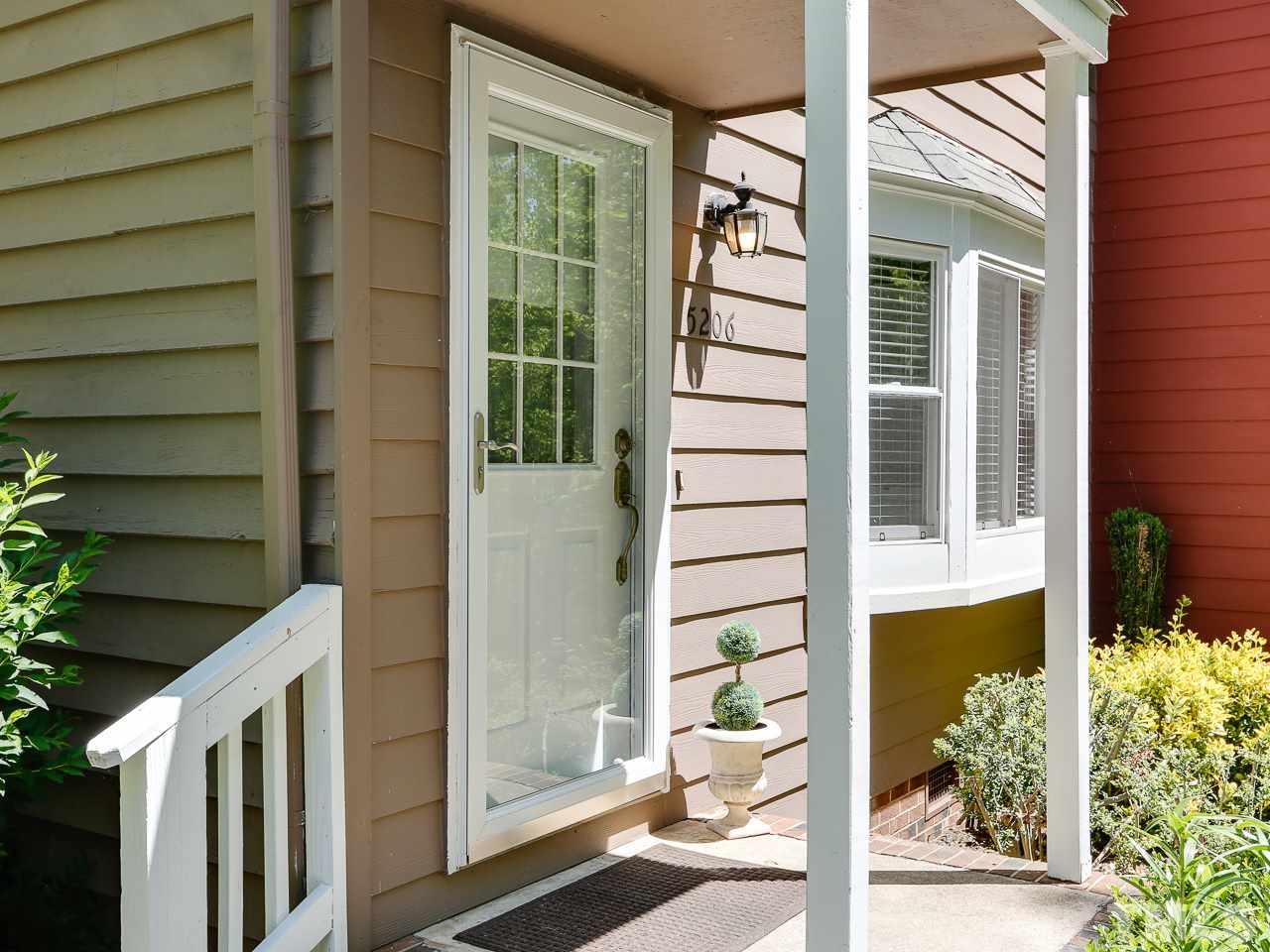 5206 Mountain Ridge Road Raleigh, NC 27612 - Photo 2 of 23 a front view of a house with a garden