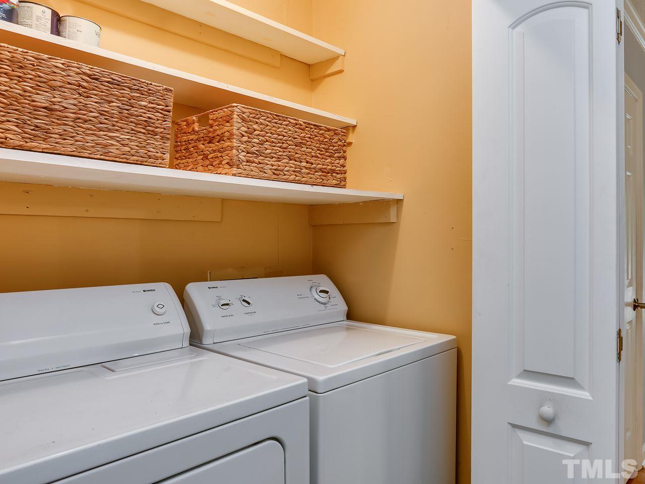 5206 Mountain Ridge Road Raleigh, NC 27612 - Photo 11 of 23 a close up of a washer and dryer