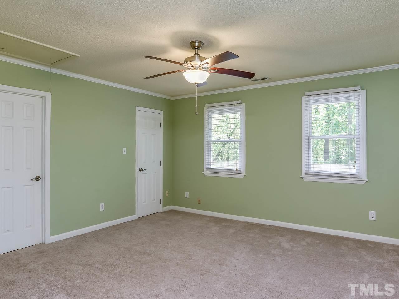 5206 Mountain Ridge Road Raleigh, NC 27612 - Photo 12 of 23 a view of an empty room with a window