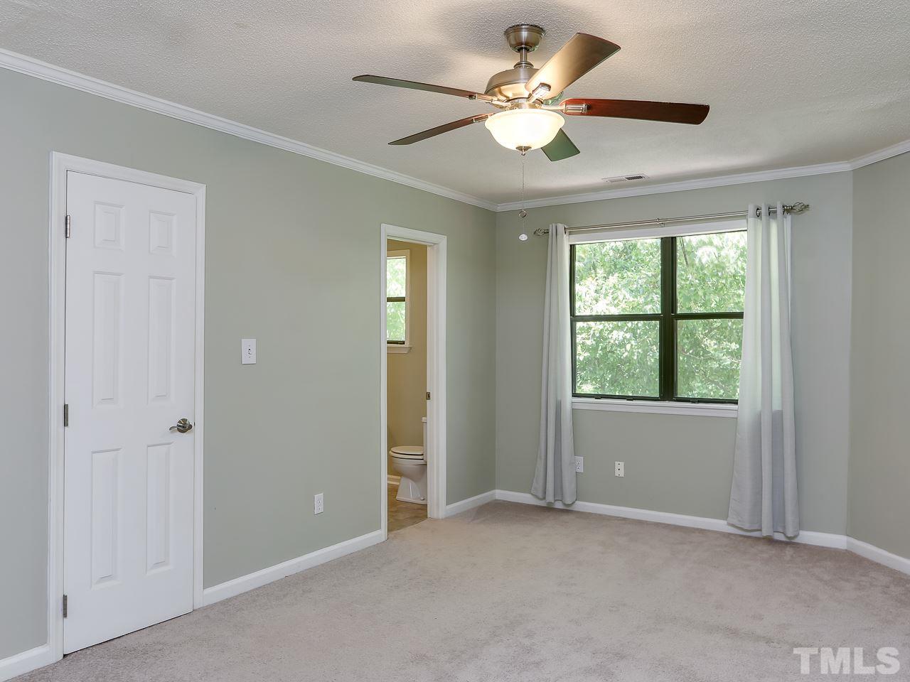 5206 Mountain Ridge Road Raleigh, NC 27612 - Photo 15 of 23 a view of an empty room with a window