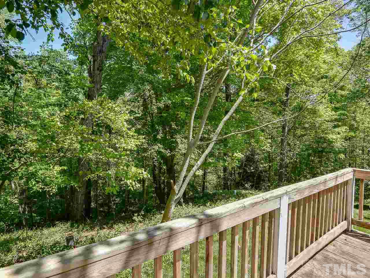 5206 Mountain Ridge Road Raleigh, NC 27612 - Photo 21 of 23 a view of a wooden fence and trees