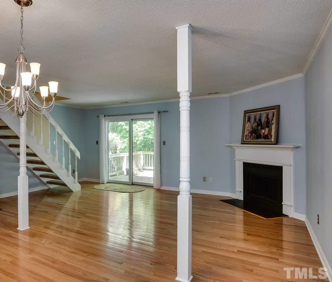 5206 Mountain Ridge Road Raleigh, NC 27612 - Photo 8 of 23 a view of a livingroom with wooden floor