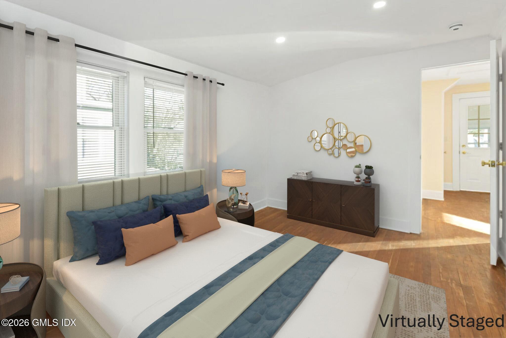 71 Prospect Street, Unit 2 Greenwich, CT 06830 - Photo 12 of 17 a bedroom with a bed and a window