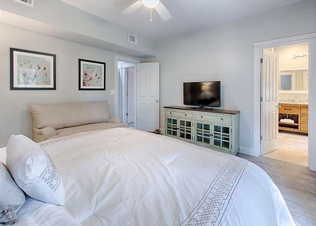 94 Pointe Circle Santa Rosa Beach, FL 32459 - Photo 7 of 12 a bedroom with a bed and a flat screen tv