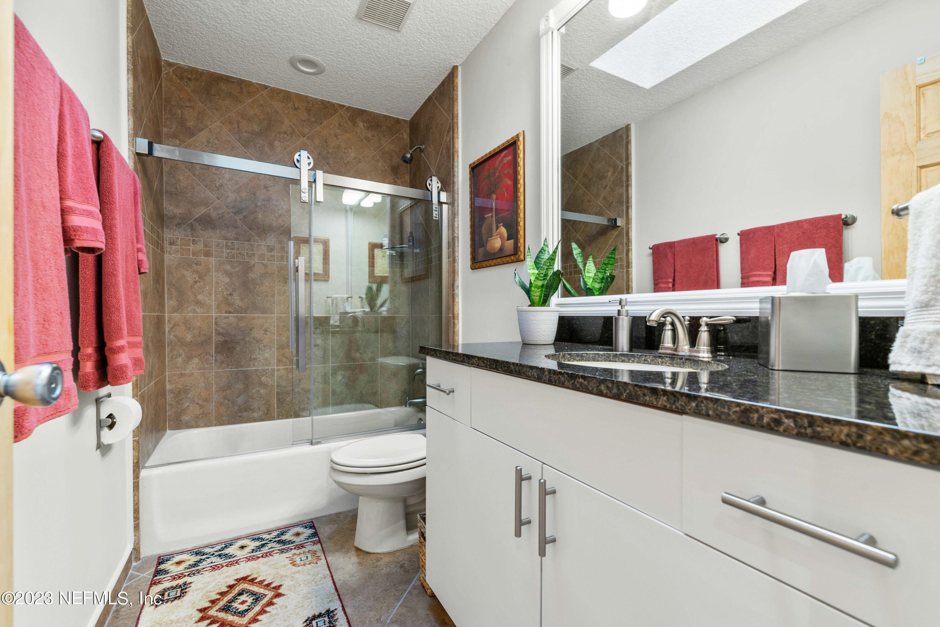 5579 Steamboat Road St. Augustine, FL 32092 - Photo 20 of 52 a bathroom with a sink a toilet and a bathtub