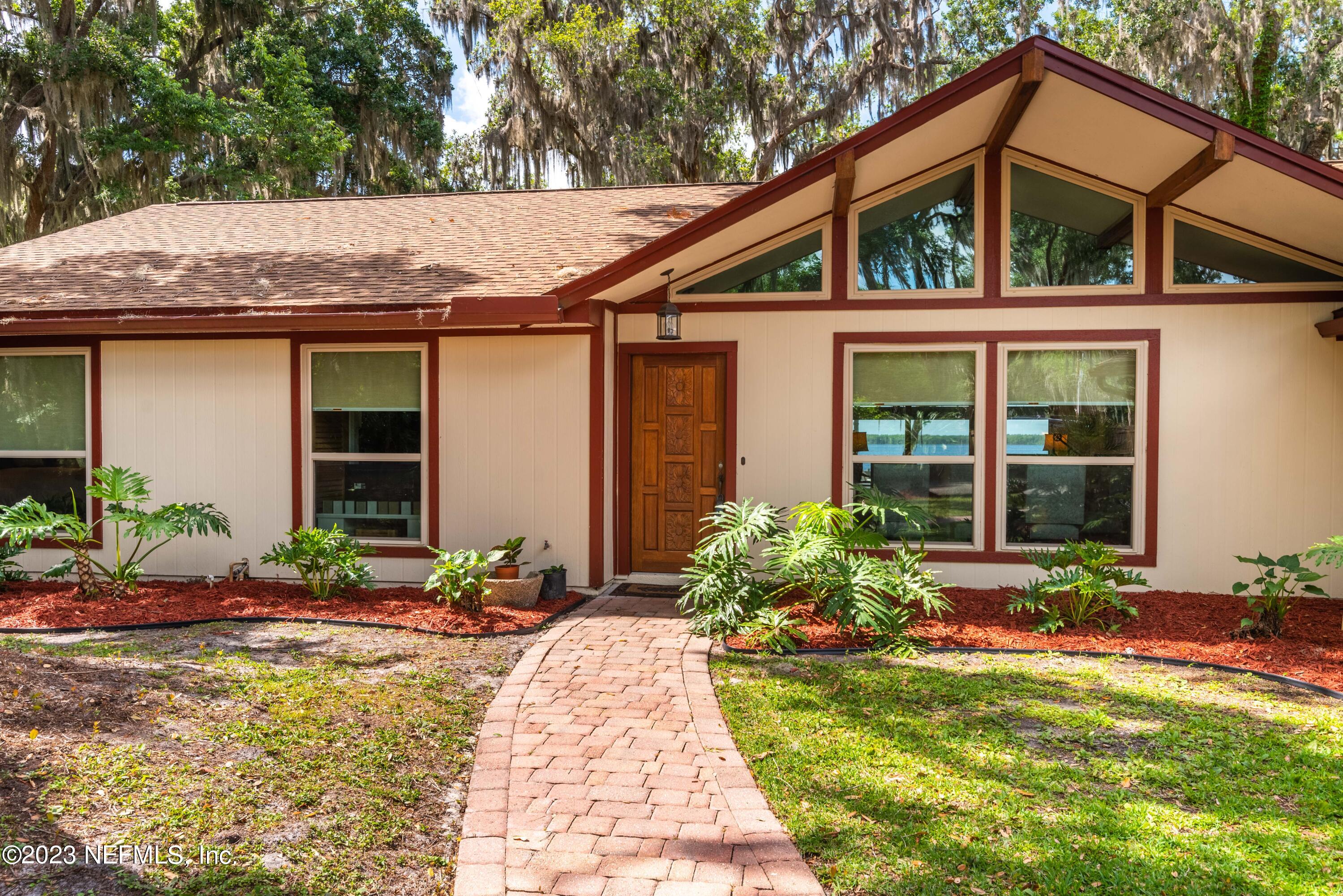 5579 Steamboat Road St. Augustine, FL 32092 - Photo 2 of 52 a front view of a house with garden