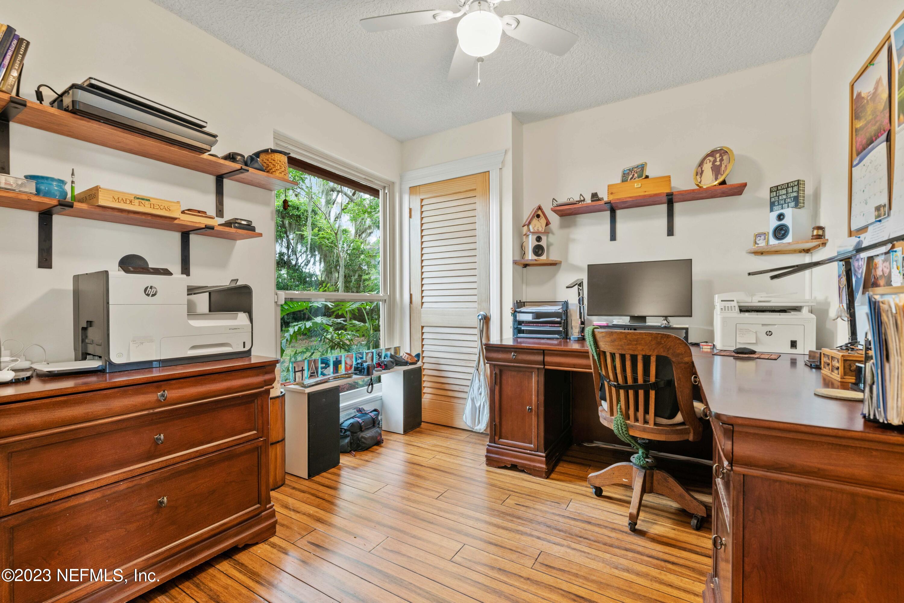 5579 Steamboat Road St. Augustine, FL 32092 - Photo 26 of 52 a view of a workspace with furniture and a window