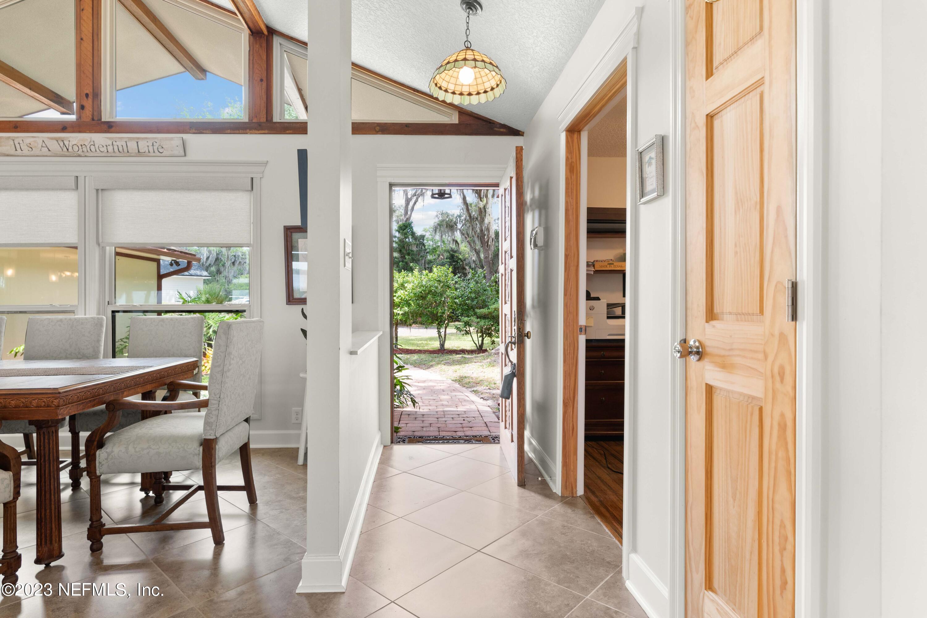 5579 Steamboat Road St. Augustine, FL 32092 - Photo 3 of 52 a view of a hallway with furniture and front door
